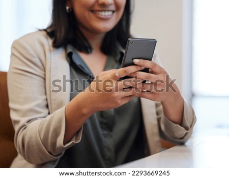 Every app makes an impact towards growing my business. Closeup shot of an unrecognisable businesswoman using a cellphone in an office.