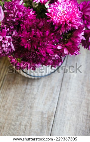 Purple chrysanthemum flowers in a vase on the table