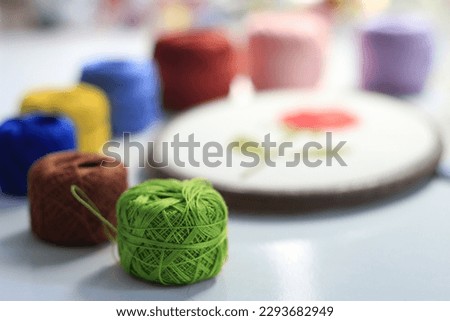 colorful threads. red green yellow blue white gray. Knitting is also used in handicraft.