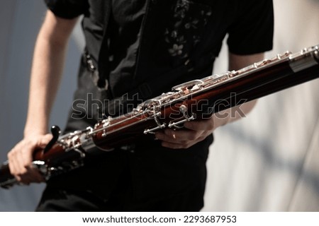 Musician playing the bassoon, concert  Royalty-Free Stock Photo #2293687953