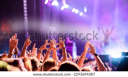 crowd partying stage lights live concert summer music festival Royalty-Free Stock Photo #2293694387