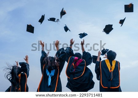 Close-up of graduation ceremony university high school graduates throwing cap on the blue sky. Royalty-Free Stock Photo #2293711481