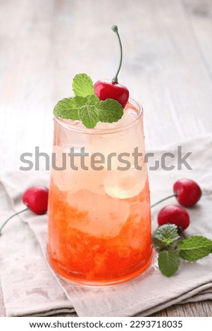Fresh ice cherry garnished with cherry fruit and mint leaves