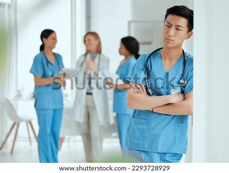Losing a patient isnt just part of a job. Shot of a medical practitioner looking stressed in the middle of a meeting in hospital. Royalty-Free Stock Photo #2293728929