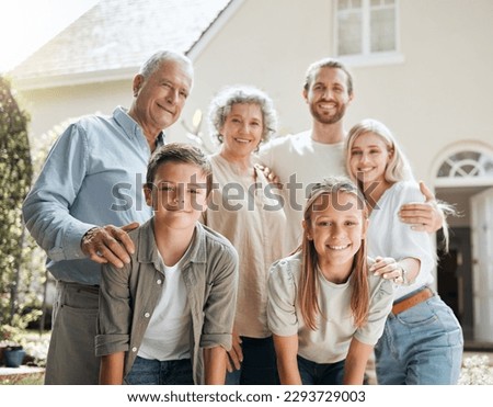 Keep your family close. Shot of a multi-generational family standing together outside. Royalty-Free Stock Photo #2293729003