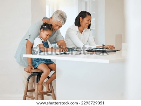 Youre as smart as your mom was. Shot of a young girl getting help from her mother and grandma while doing her homework at home.