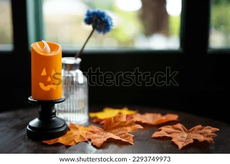 Halloween decorations background. Halloween with candle on wooden table Halloween holiday