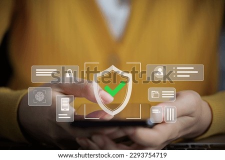 Online privacy security concept. Female hand scanning fingerprints on mobile phone to pass authentication system before accessing. Royalty-Free Stock Photo #2293754719