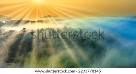Aerial view of Xuan Tho suburbs near Da Lat city at morning with misty and sunrise sky. This place is considered most beautiful and peaceful place to watch sunrise in highlands of Vietnam Royalty-Free Stock Photo #2293778145