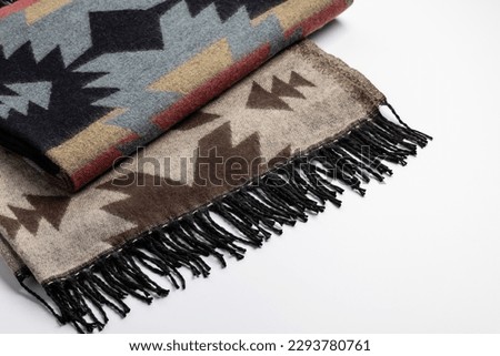 Scarf, stole with ornament and fringe on a white background. Indian drawing, close-up.