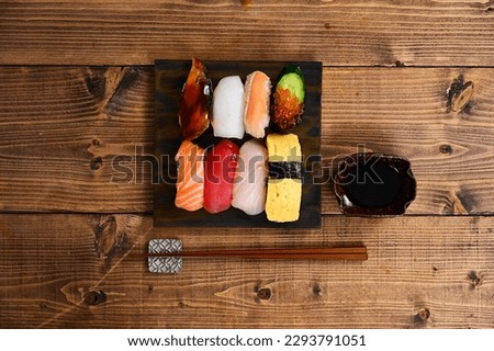 hand-formed sushi with a topping of seafood, etc.