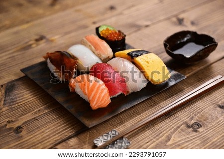 hand-formed sushi with a topping of seafood, etc.