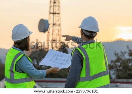 Professional team Engineer managers workers working outdoors with telecommunication antenna and sunset background.	 Royalty-Free Stock Photo #2293796181