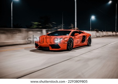 Super Car Rolling Shot Photo in Night Royalty-Free Stock Photo #2293809805