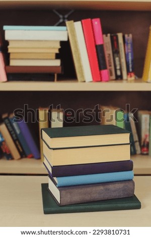 Pile of books and stack, on the shelf, blurred background. education concept. close up