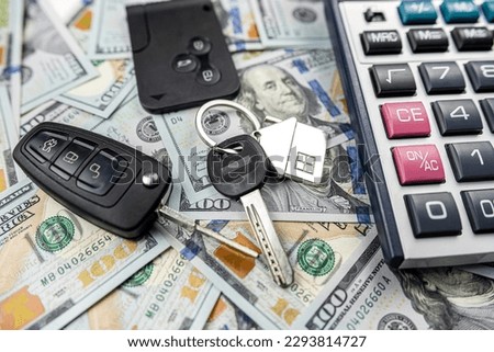 keys of house and car with calculator on us dollar money, Investment in future, purchase or rent concept