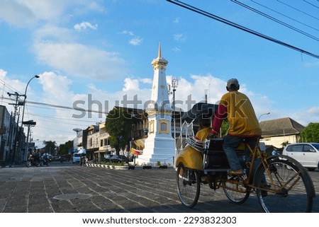 pedicab near the yogyakarta monument Royalty-Free Stock Photo #2293832303