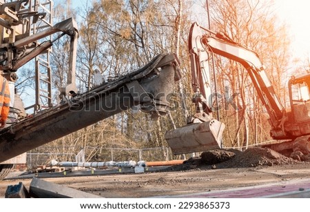 Concrete delivered on the construction site and offloaded from a volumetric concrete mixer Royalty-Free Stock Photo #2293865373
