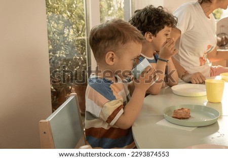 Kids having breakfast in kindergarten
