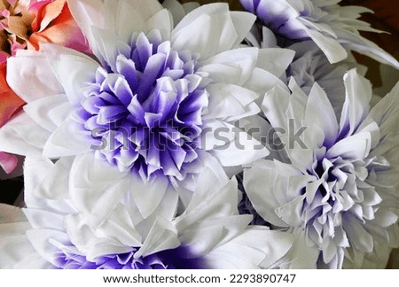 background with colorful artificial flowers
