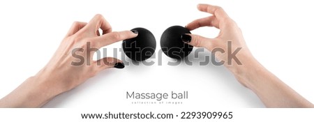 Massage black ball in female hand for trigger points isolated on a white background. Concept of myofascial release. High quality photo