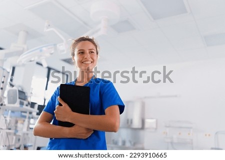 Portrait of young nurse in surgical department. Royalty-Free Stock Photo #2293910665