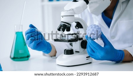 Male biotechnologist testing new chemical substances in laboratory.