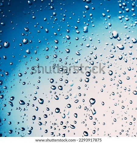 Water drops out of blue lens 