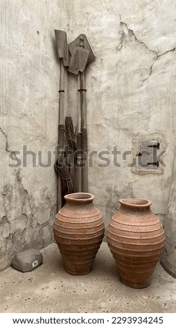 In this picture the two pots we see are beautiful carved earthen pots. The design is so unique and beautiful which cannot be seen nowadays. Earthen pots keep the water cool and are used in summer seas