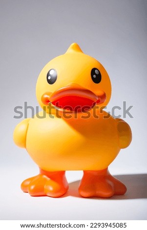 What does the duck say. Shot of a rubber duck against a studio background.