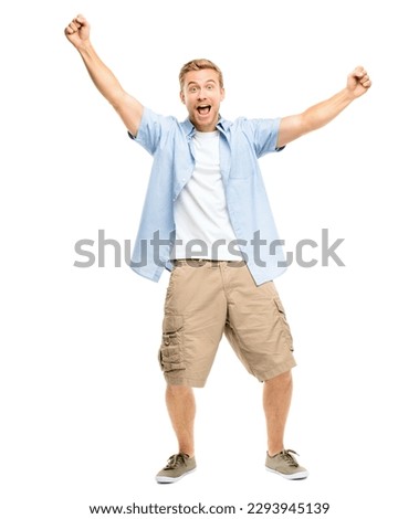 I cant believe it. Full length shot of a handsome young man standing alone in the studio with his arms raised in celebration. Royalty-Free Stock Photo #2293945139