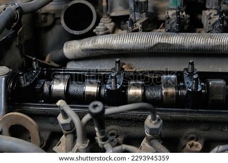 Broken and bent diesel engine camshaft on a car.  Work of car services Royalty-Free Stock Photo #2293945359