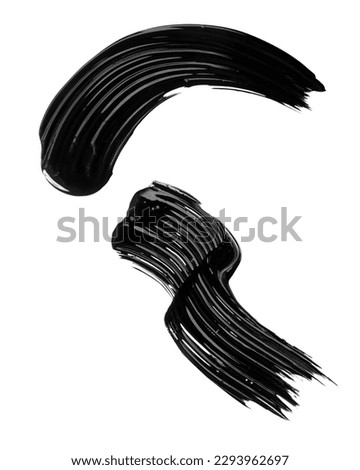 Smudged black mascara on white background. Cosmetic product swatch. Paint brush stroke Royalty-Free Stock Photo #2293962697