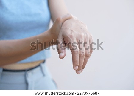 Asian woman having hand numbness