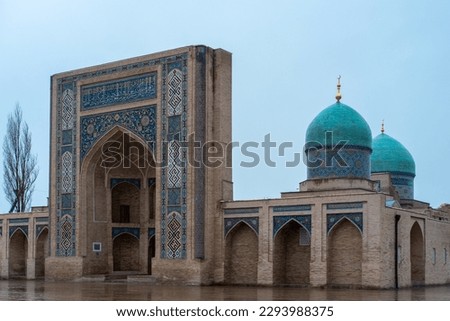Beautiful Uzbekistan Tashkent classic mosaic photo, view of Barak Khan Madrasah Mosque with Arabic Qoran writings on the building, Hast Imam Square (Hazrati Imam) is a religious center of Tashkent.