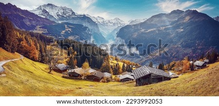 Wonderful Sunny landscape in Swiss alps. Wengen popular tourist village over the Lauterbrunnen valley, Switzerland. Europe. Concept of an ideal resting place. Creative image.