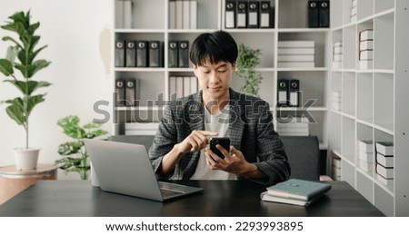 Businessman s hands typing on smartphone, tablet and laptop keyboard computer, typing, online in modern office