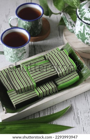 Pandan chocolate layer cake is a traditional Indonesian cake made from coconut milk and rice flour with chocolate and pandan flavors
