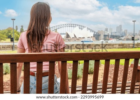 Rear view of a woman looking at the Sydney Opera House Royalty-Free Stock Photo #2293995699