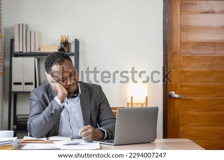 Concept Burnout Syndrome. African American businessman feels uncomfortable working, which is caused by stress, accumulated from unsuccessful work And less rest body. Consult a specialist psychiatrist.