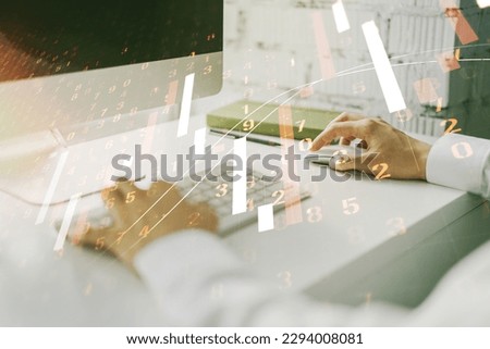 Abstract creative financial graph with hand typing on laptop on background, forex and investment concept. Multiexposure