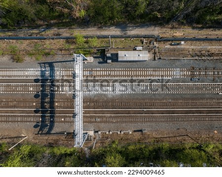 An aerial view of a train tracks on Long Island, New York on a sunny morning.