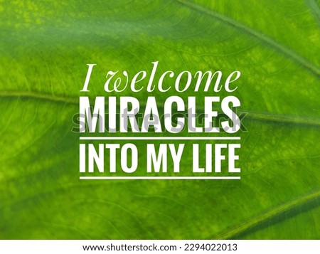 Motivation : I welcome miracles into my life, on a green leaf background