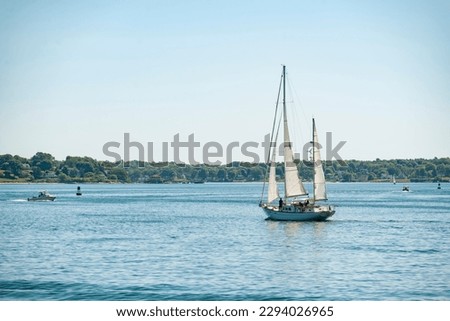 View of Portland Harbor and the Casco Bay with a sail boat in Maine, USA