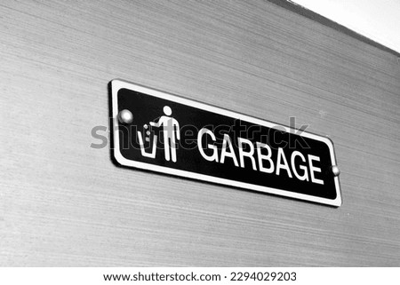Garbage sign on door in condo.