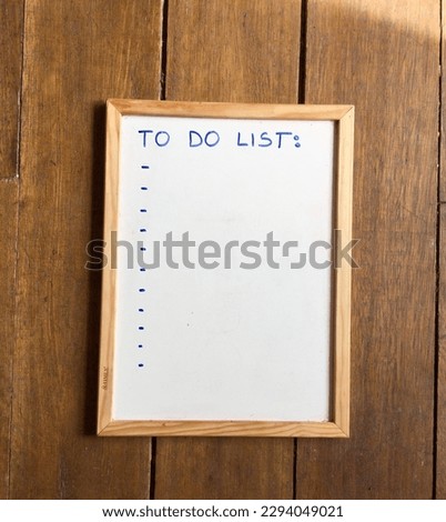 A whiteboard with a to do list