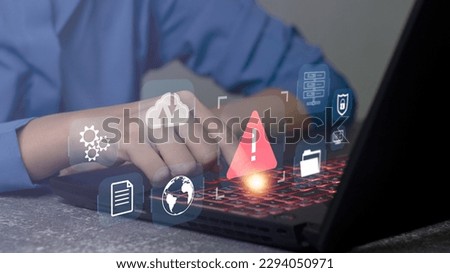 Developer programmer using laptop with warning triangle sign for alert found error and maintenance concept