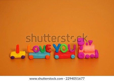 A toy train with the inscription I love you.  Festive decorations. Children's toys.