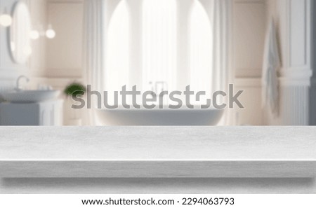 Marble table top with rest room bath tube blurry loose focal background.  Close up photo of contemporary interior