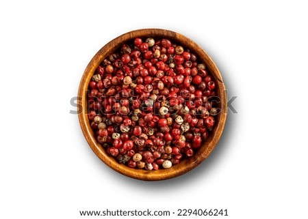 Red pepper seeds bowl. Up view studio shoot on white background.